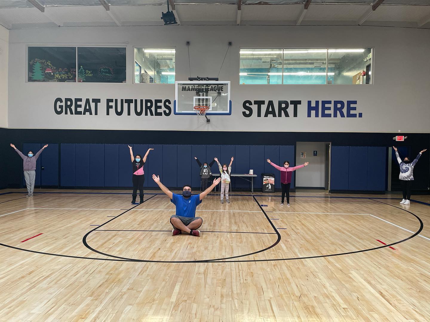 Kids in gym with staff.